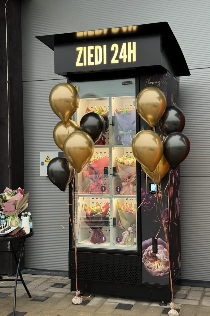 customer choosing bouquet from flower vending machine 24/7 Flowey Riga
