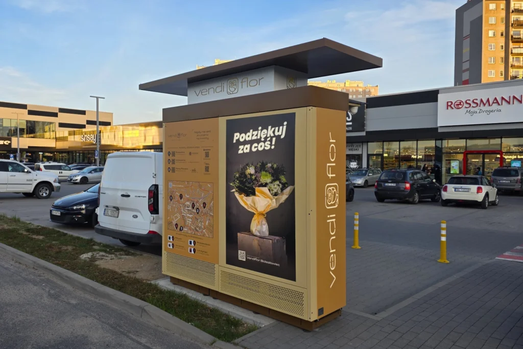 Tył Kwiatomatu VendiFlor z podświetlaną reklamą i indywidualnym nadrukiem, pokazujący możliwości personalizacji nowoczesnych automatów do sprzedaży kwiatów.